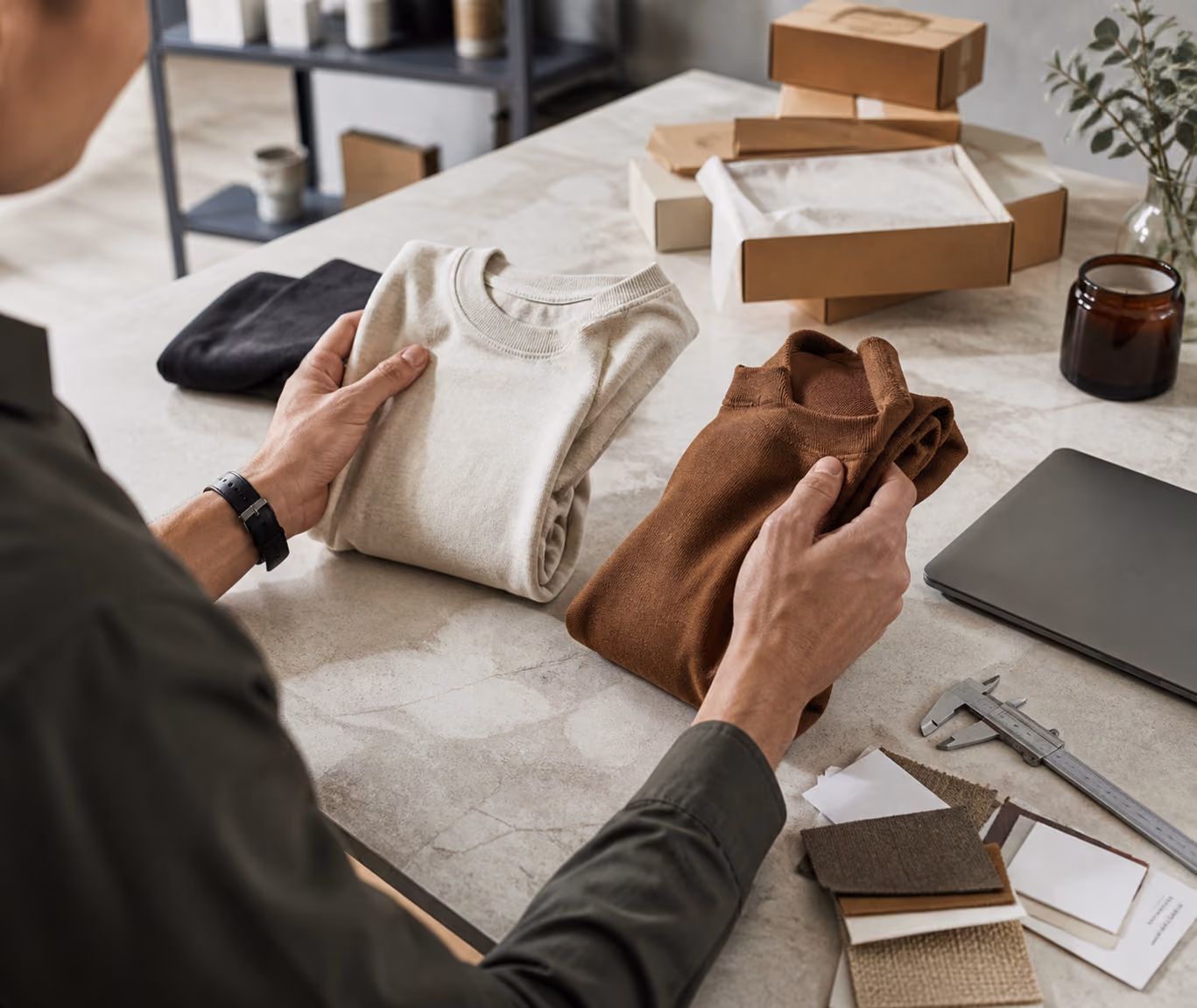 Merchant comparing unbranded product samples at a sourcing workspace